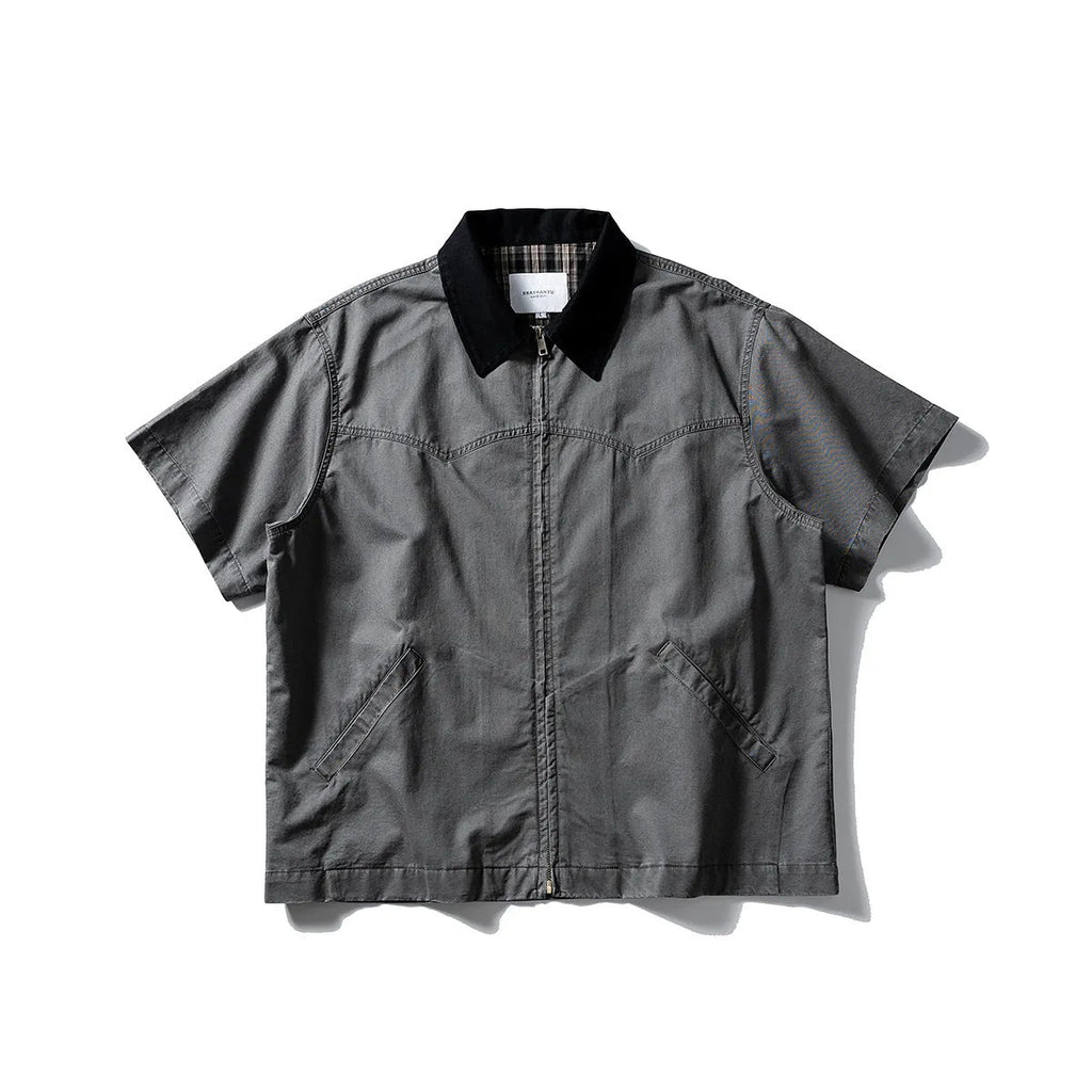 Washed khaki cotton overalls shirt with short sleeves and loose cardigan style on a hanger