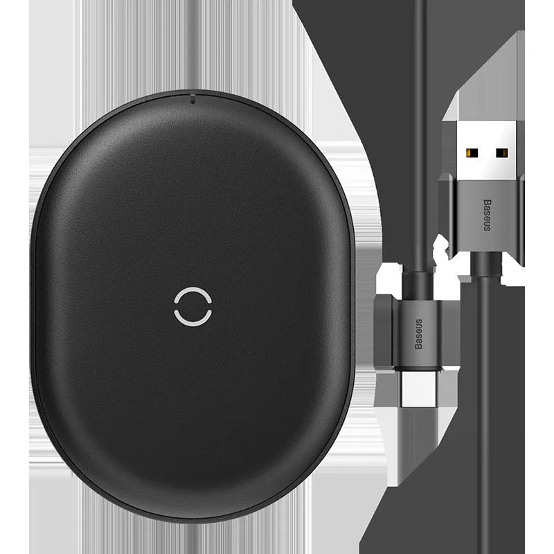 Baseus Rough 15W wireless charging pad in black and white on a table