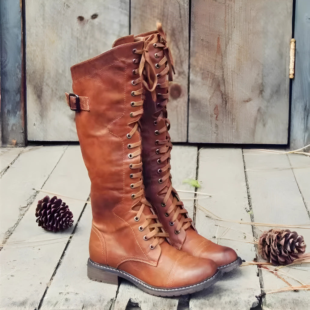 Women's black casual high-leg boots with a chunky low heel and round toe.