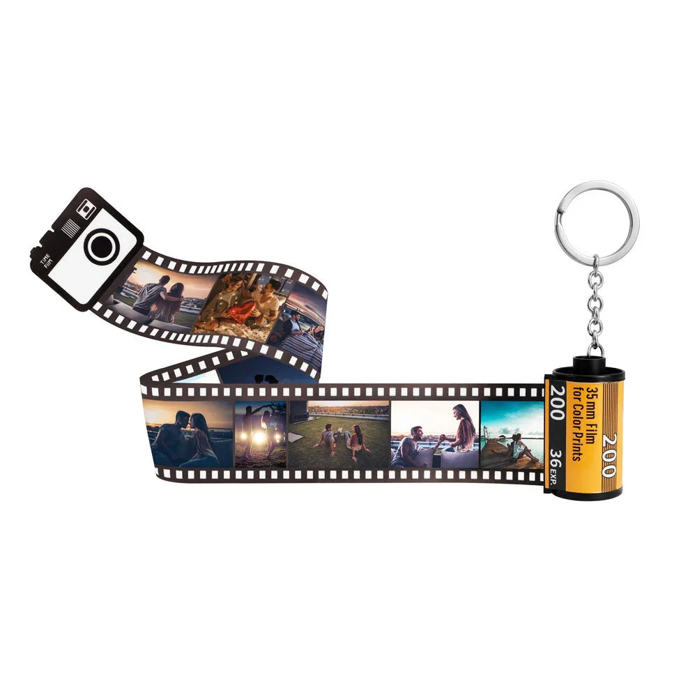 Custom film keychain with ten photographs on a film strip and a rewinder accessory