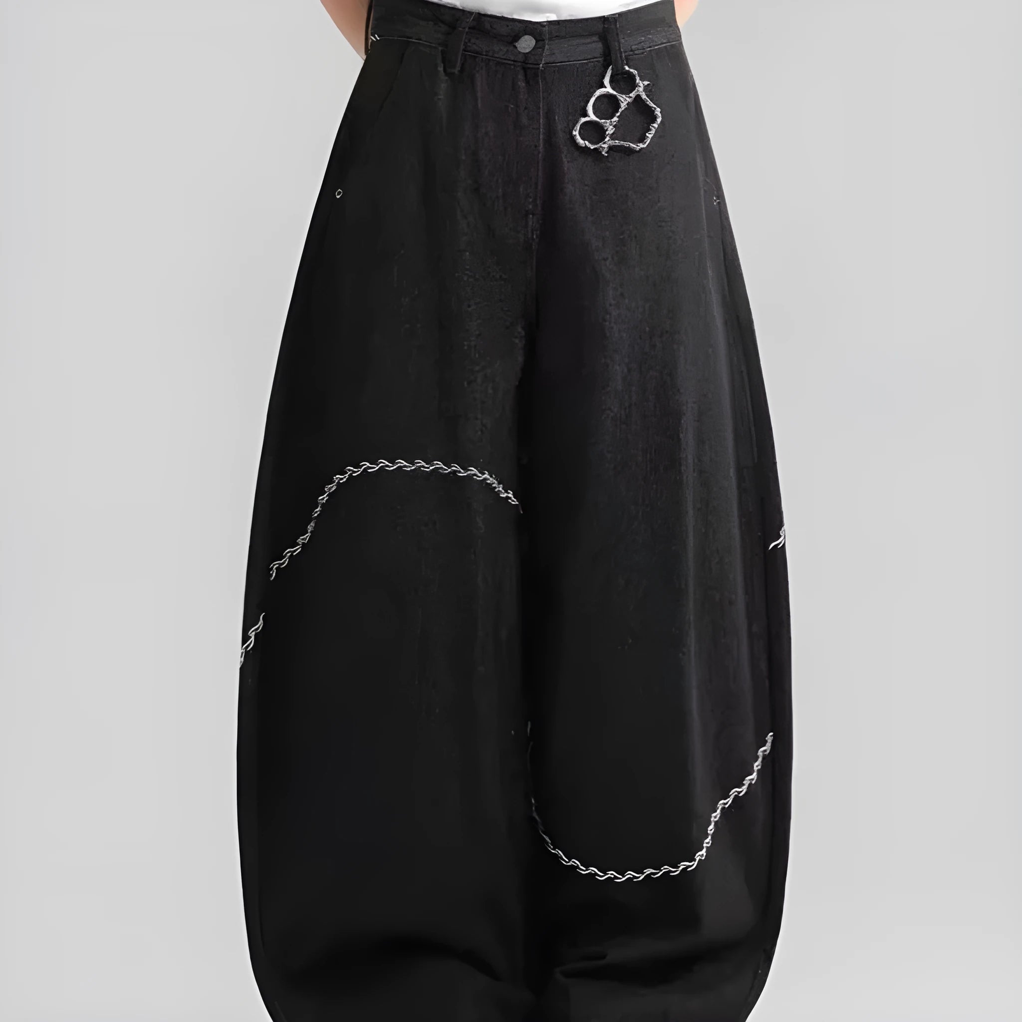 Black straight-leg denim trousers with micro-elastic fabric and mid-waist zip fly