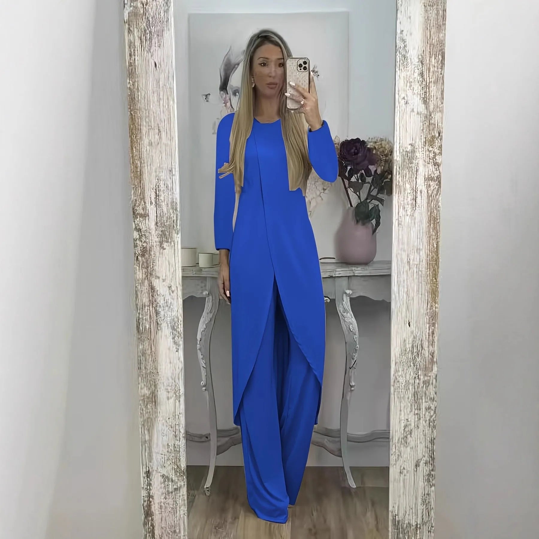 Black casual polyester two-piece tracksuit with long sleeves and trousers on a hanger