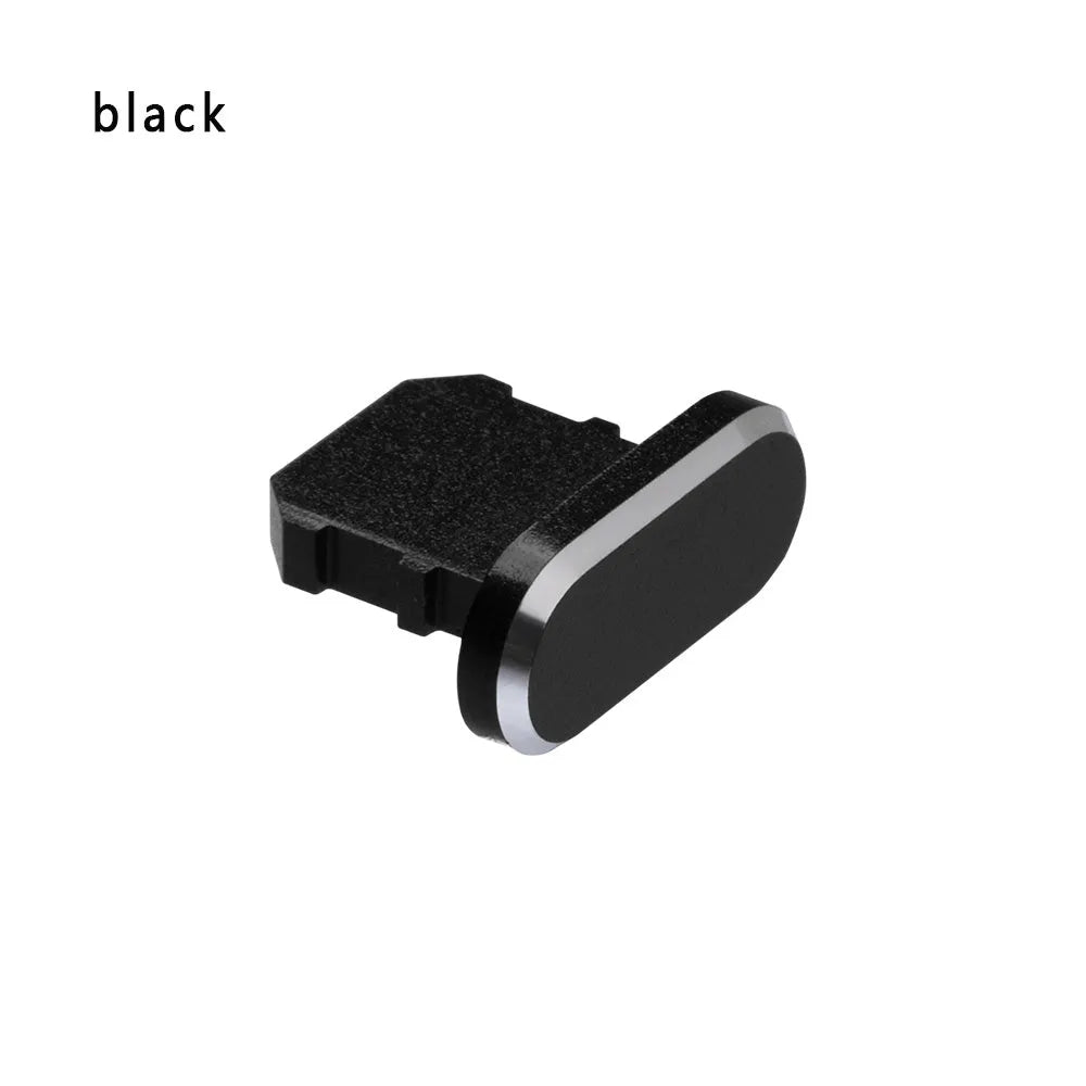Aluminium alloy iPhone charging port dust plug in metallic colours on a dark background.