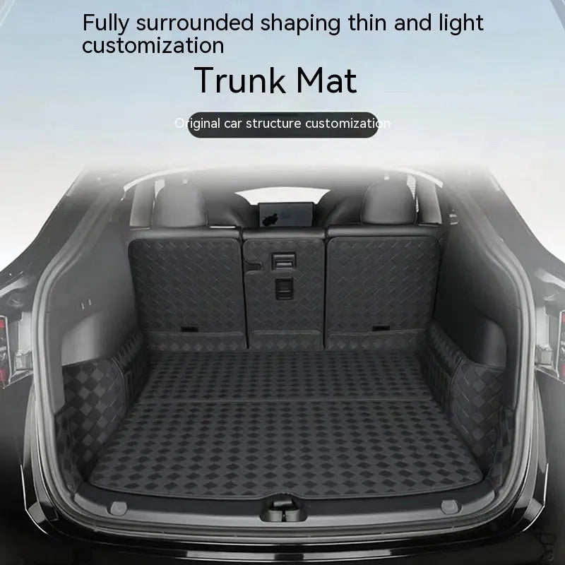 Black leather boot liner mat fitted in the luggage compartment of a Tesla Model Y
