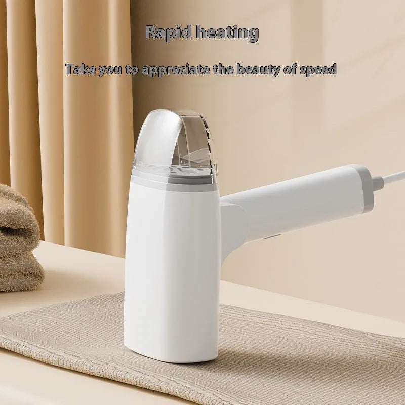 Blue handheld garment steamer with water tank and power cord for portable clothes wrinkle removal