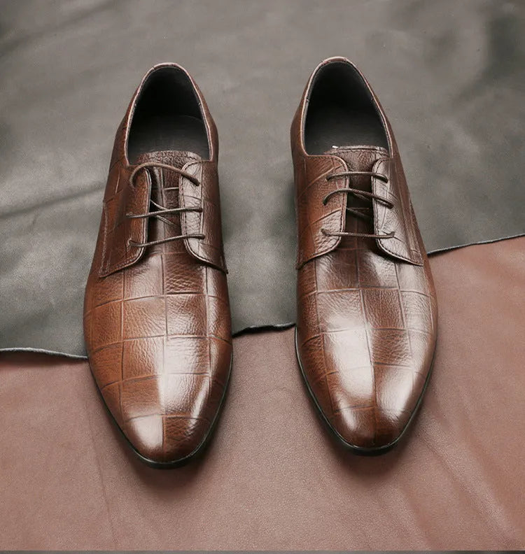 Men's black checkered leather derby shoes with a pointed toe on a rubber sole