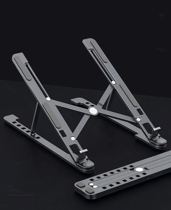 Foldable aluminium laptop stand in silver colour, shown in open and closed positions next to a laptop.
