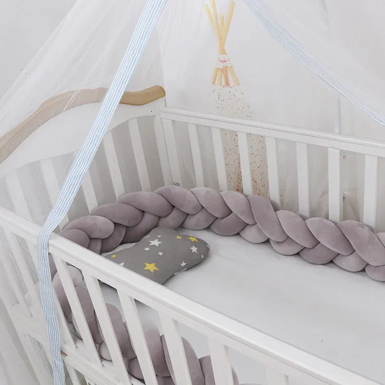 Braided knot baby crib bumper pillow in spandex velvet showing bendable design and colour options.