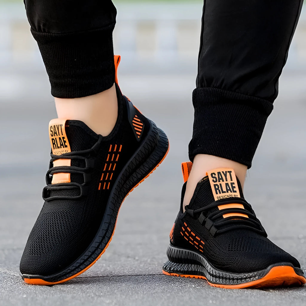 Men's black casual trainers with cross strap detail and Flying Weave upper material