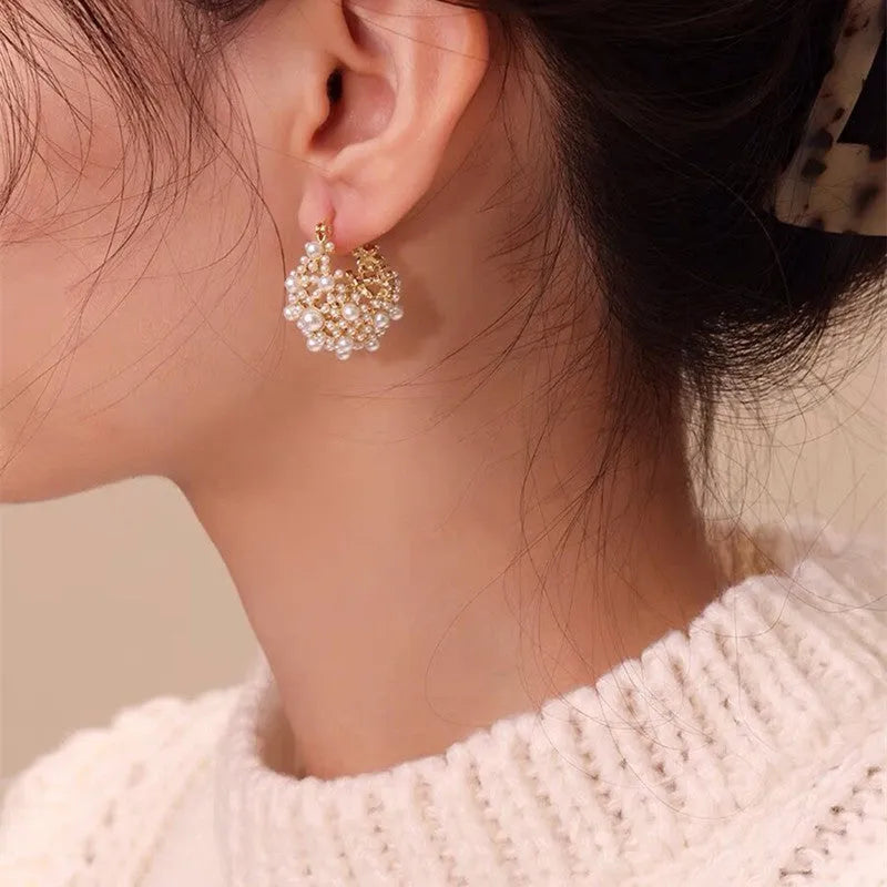 Gold-colour women's flower basket earrings with copper construction and small bead inlay detail.