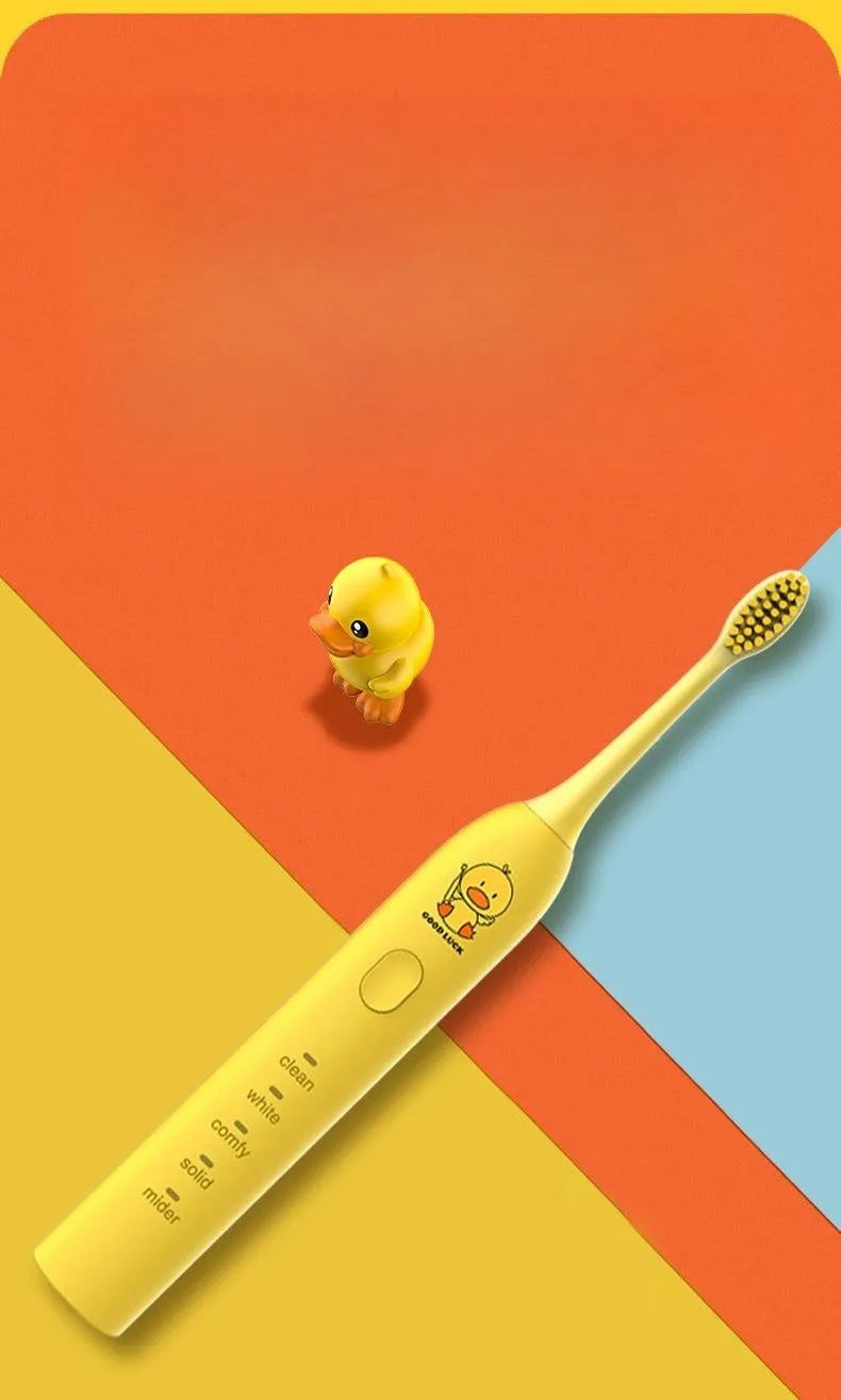 Rechargeable electric toothbrush with small yellow duck design, soft bristles, and USB charging cable
