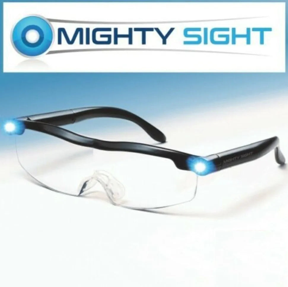Transparent black USB LED reading glasses with illuminated frame on a desk