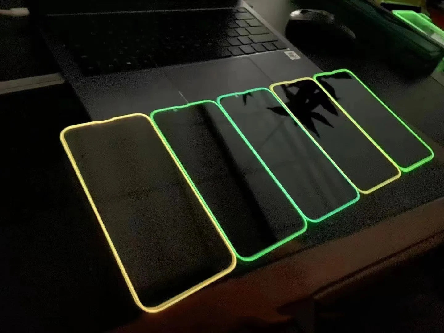 Fluorescent tempered glass iPhone screen protector in luminous colours showing full screen coverage