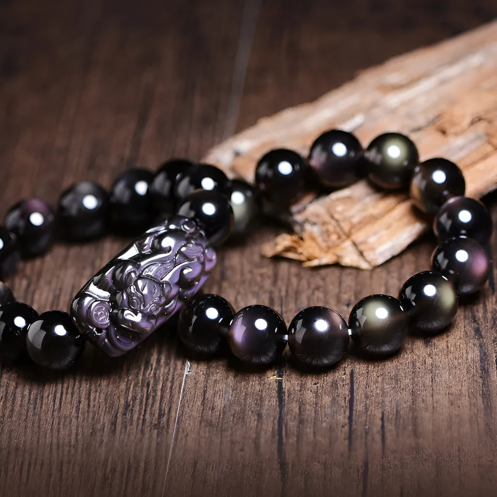 Polished crystal Pi Xiu bracelet with ice stone beads on wrist