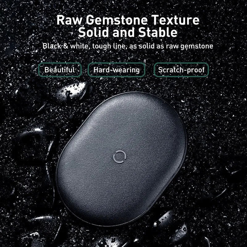 Baseus Rough 15W wireless charging pad in black and white on a table