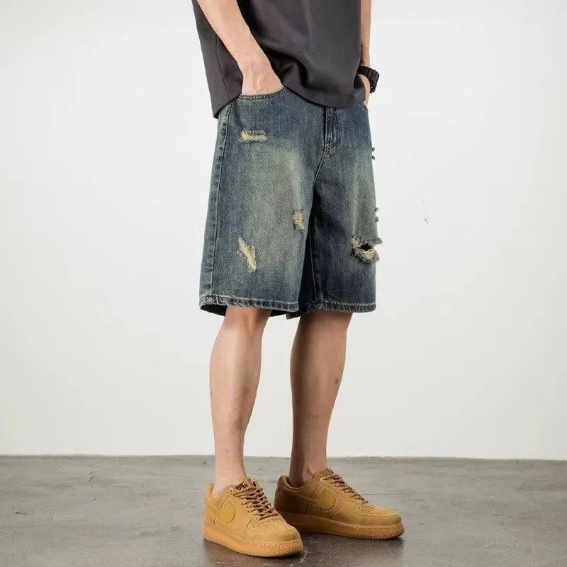 Men's blue denim shorts with retro loose hole design and straight cut