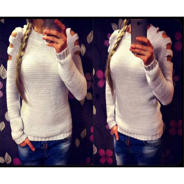 Women's white hollow-out crocheted knit long sleeve pullover shirt on a hanger.