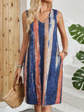 V-neck sleeveless dress with striped colour block pattern in midi length