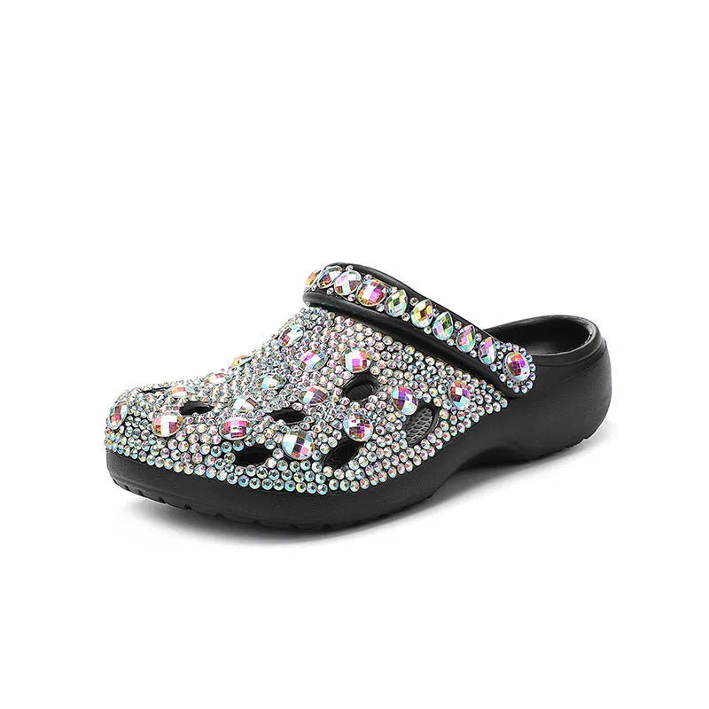 Black women's platform sandals with a perforated design and rhinestone details on the EVA upper.