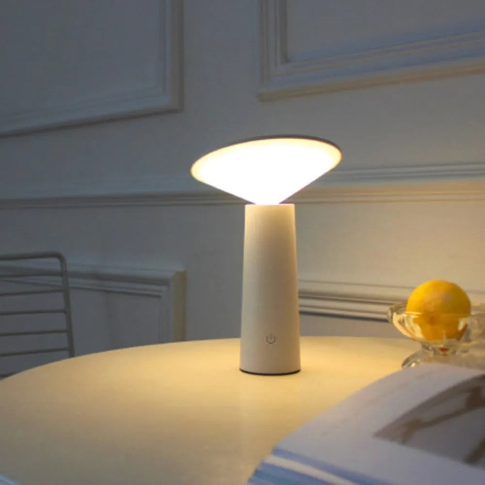 Black USB LED table lamp with touch sensor and adjustable head on wooden desk