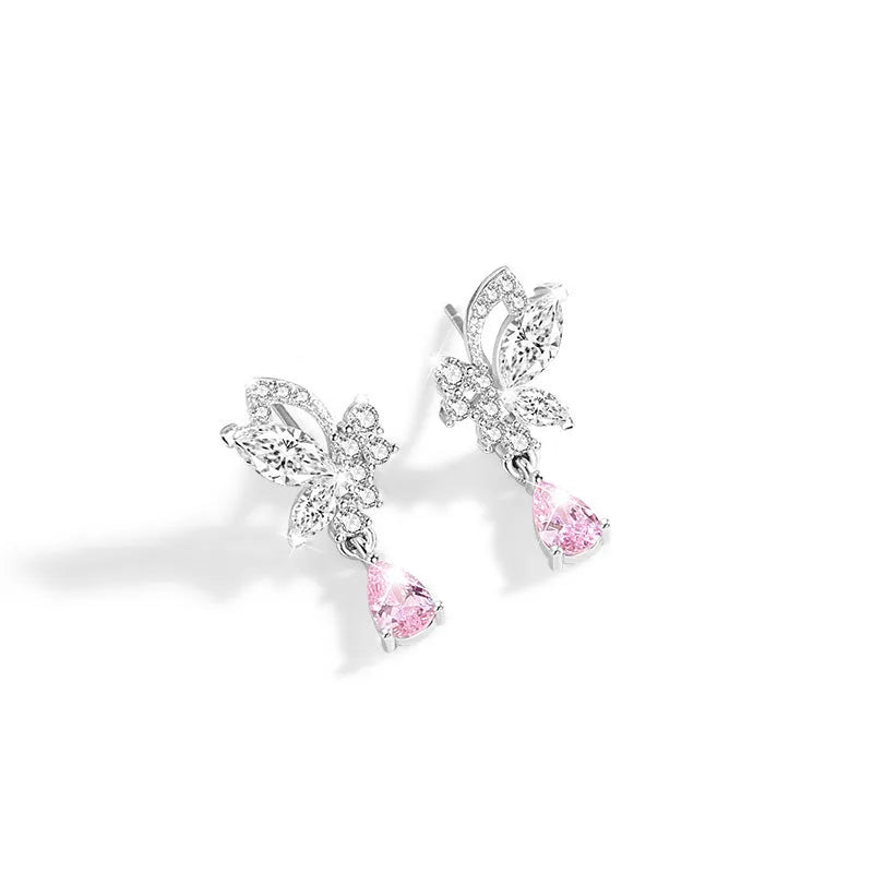A pair of silver butterfly stud earrings with clear crystal details on a white background.