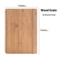 Erasable coil notebook with stone paper pages and customisable cover options including black, blue, and wood grain designs.