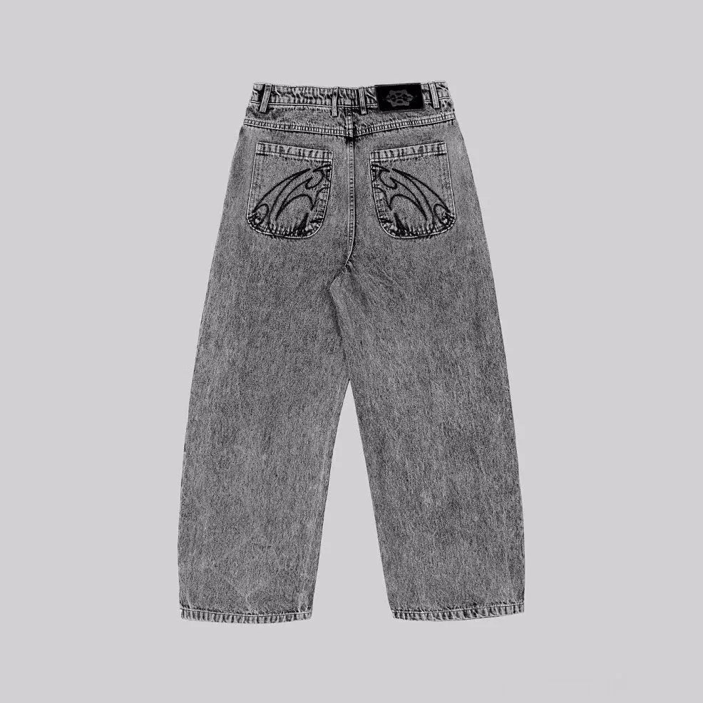 Grey loose straight-leg cotton denim trousers for men and women showing mid-waist design