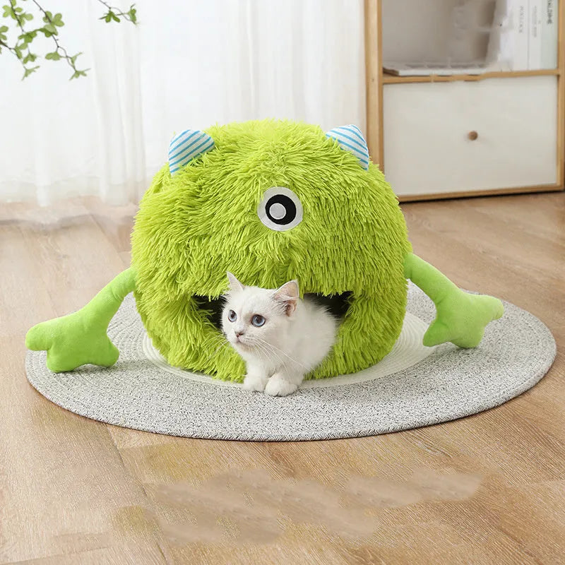 A round fluffy pet bed for cats and small dogs on a wooden floor.