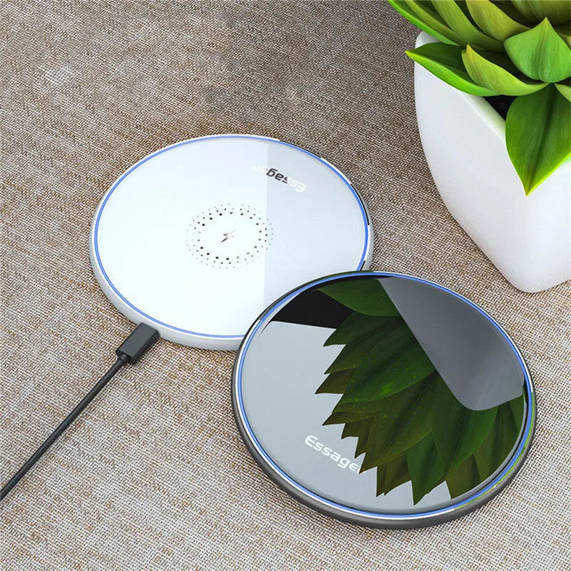 Black or white aluminium alloy wireless charging pad with LED status light, shown with a smartphone on top.