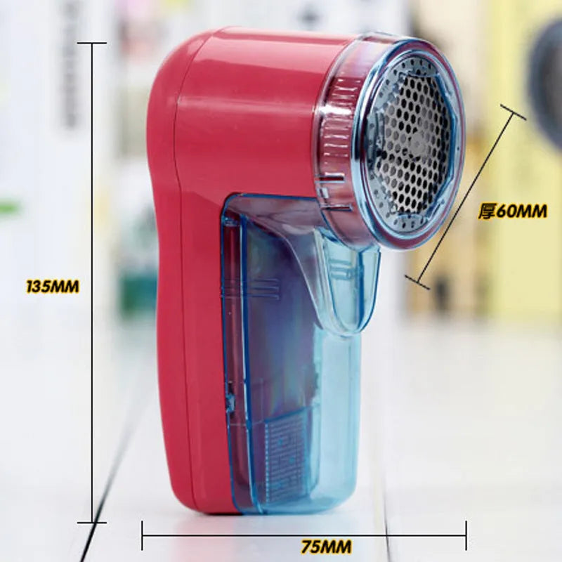 Portable electric clothing lint remover with compact rectangular design showing dimensions