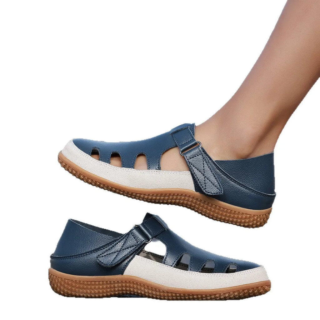 Women's plus size flat sandals with hollow out toe cap in blue, red, or white on thick rubber sole.