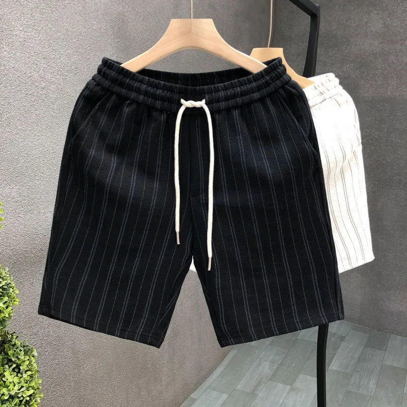 Men's black and white striped fleece-lined casual shorts with elastic waistband showing straight leg ankle banded design