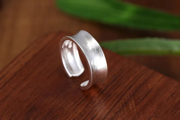 Geometric open ring with frosted sterling silver finish and adjustable opening