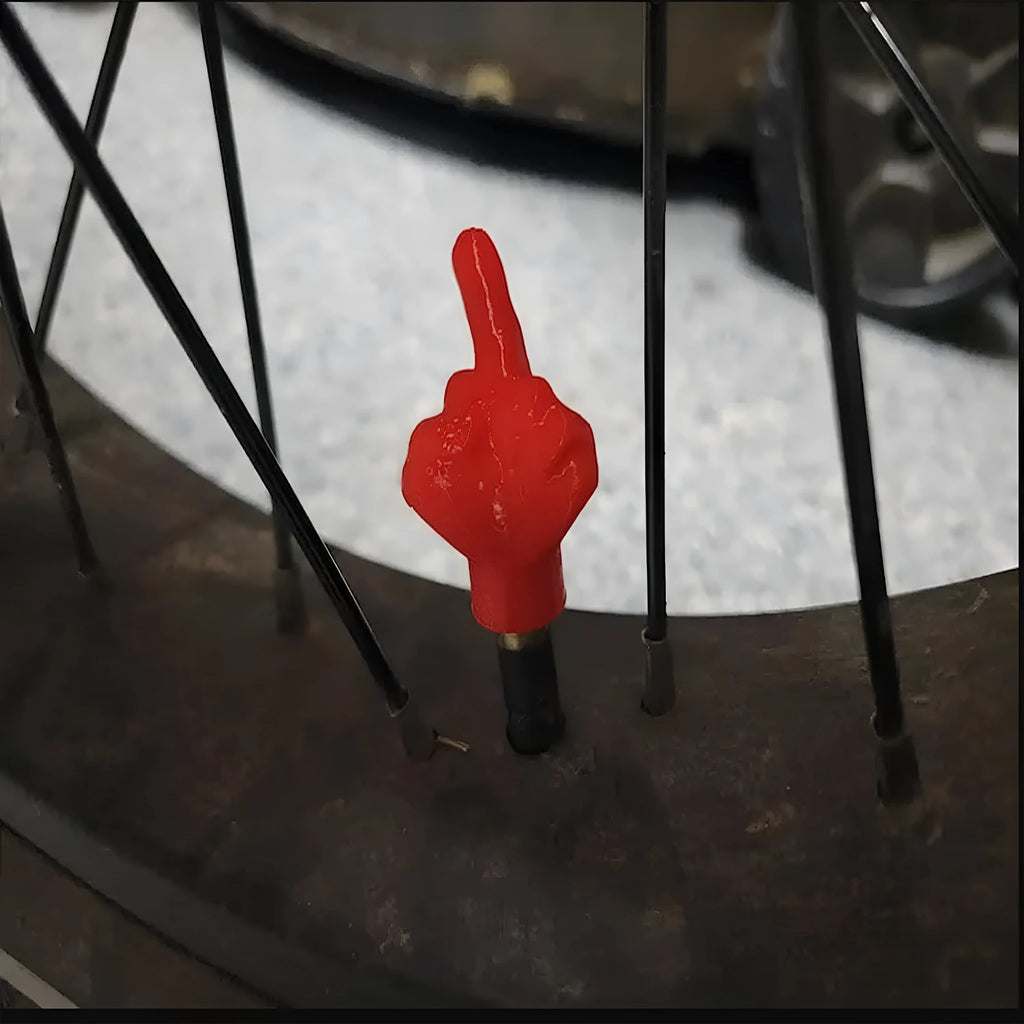 Eight latex tyre valve caps showing four black and four skin-coloured pieces for car tyre protection