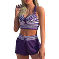 Women's two-piece polyester bikini swimsuit in a print pattern, shown on a mannequin.