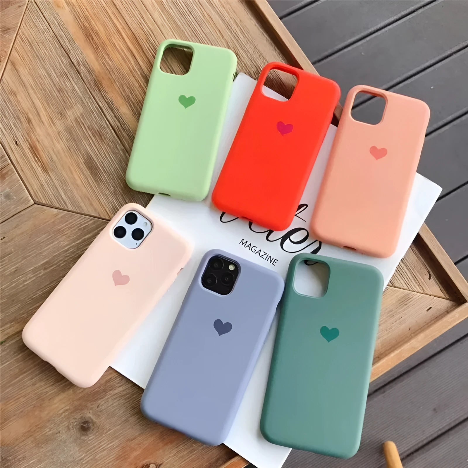 A solid colour silicone phone case for an iPhone, shown in one of six available colour options.