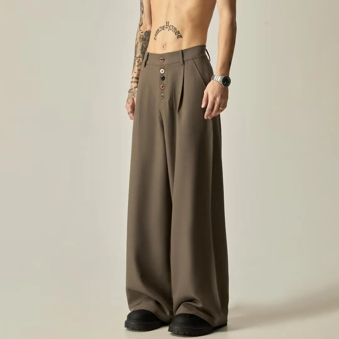 Man wearing black solid colour wide-leg casual trousers with a vertical tube design.