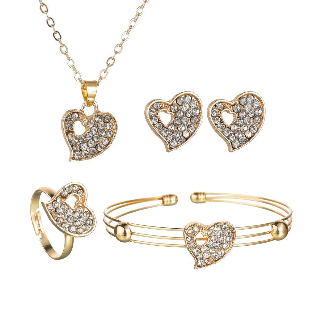Gold women's jewellery set featuring earrings, an adjustable necklace, and a bracelet with heart, water drop, and bell pendants.