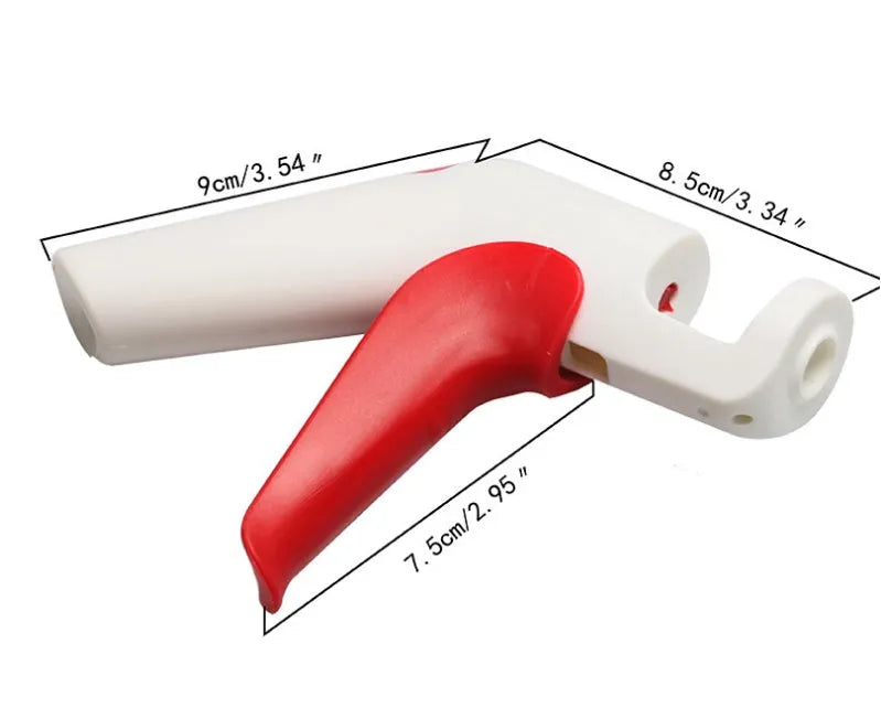 Close-up of a manual cherry pitter tool showing plastic handle and stainless steel mechanism.