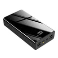 Large black and red 40000mAh power bank showing LCD screen displaying battery percentage.