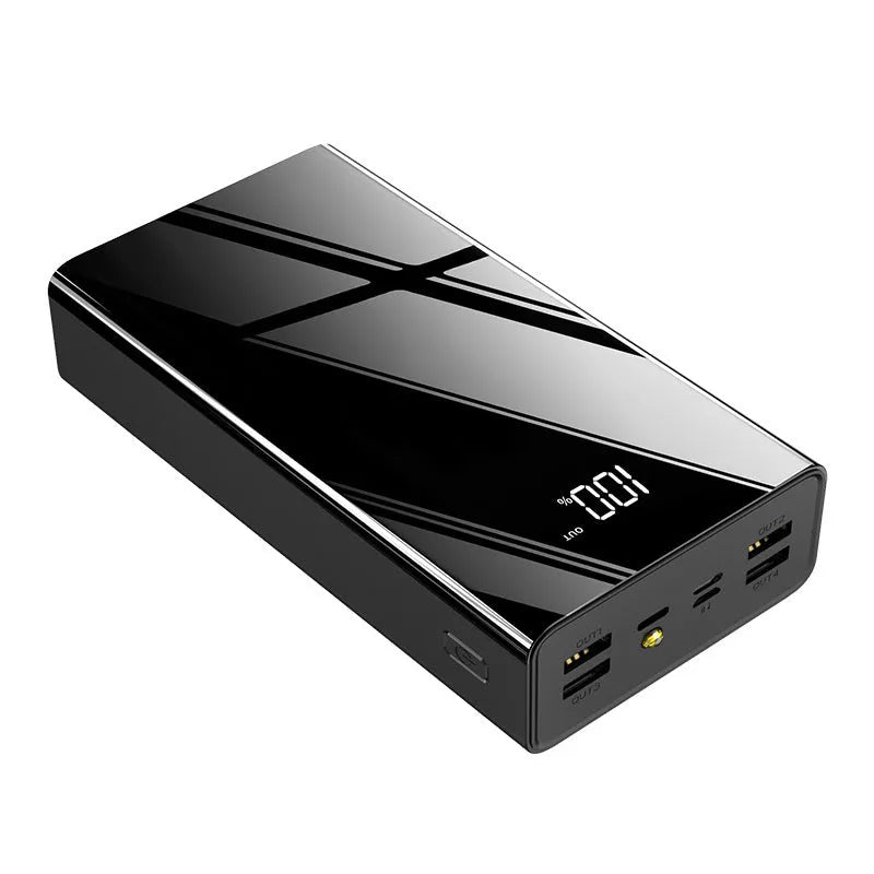 Large black and red 40000mAh power bank showing LCD screen displaying battery percentage.