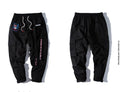 Influx men's loose fit Harajuku style cargo trousers in black with drawstring waist