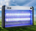 Indoor electric mosquito killing lamp with UV light and electric grid for fly and insect control.