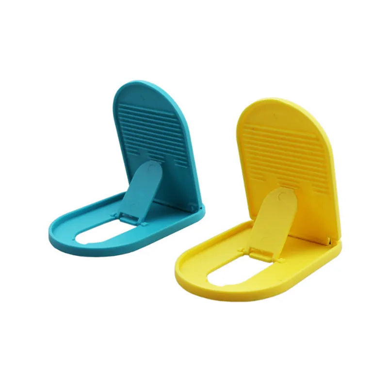 Plastic mobile phone stand with lazy bracket design shown in multiple colour options on a desk