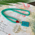 Hand-woven turquoise mesh flower pendant necklace on ball bead chain with adjustable length