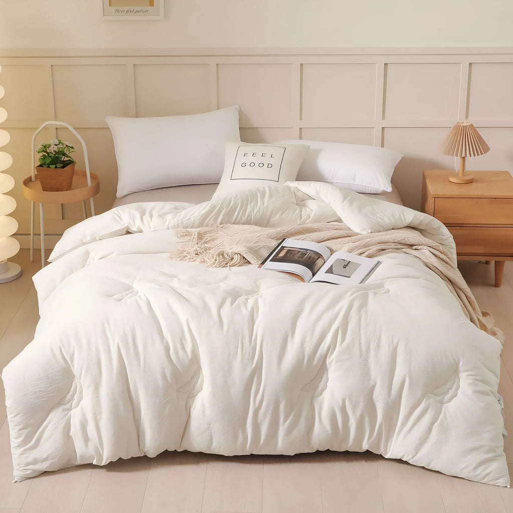Soybean fibre pure cotton quilt in grey on a bed, showing twill weave fabric and neat stitching.
