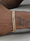 Gold tennis bracelet for men and women made of titanium steel with gemstone inlay on a wrist