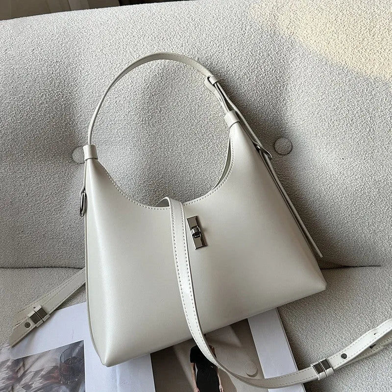 Genuine leather crossbody shoulder bag in dumpling shape with internal organiser compartments