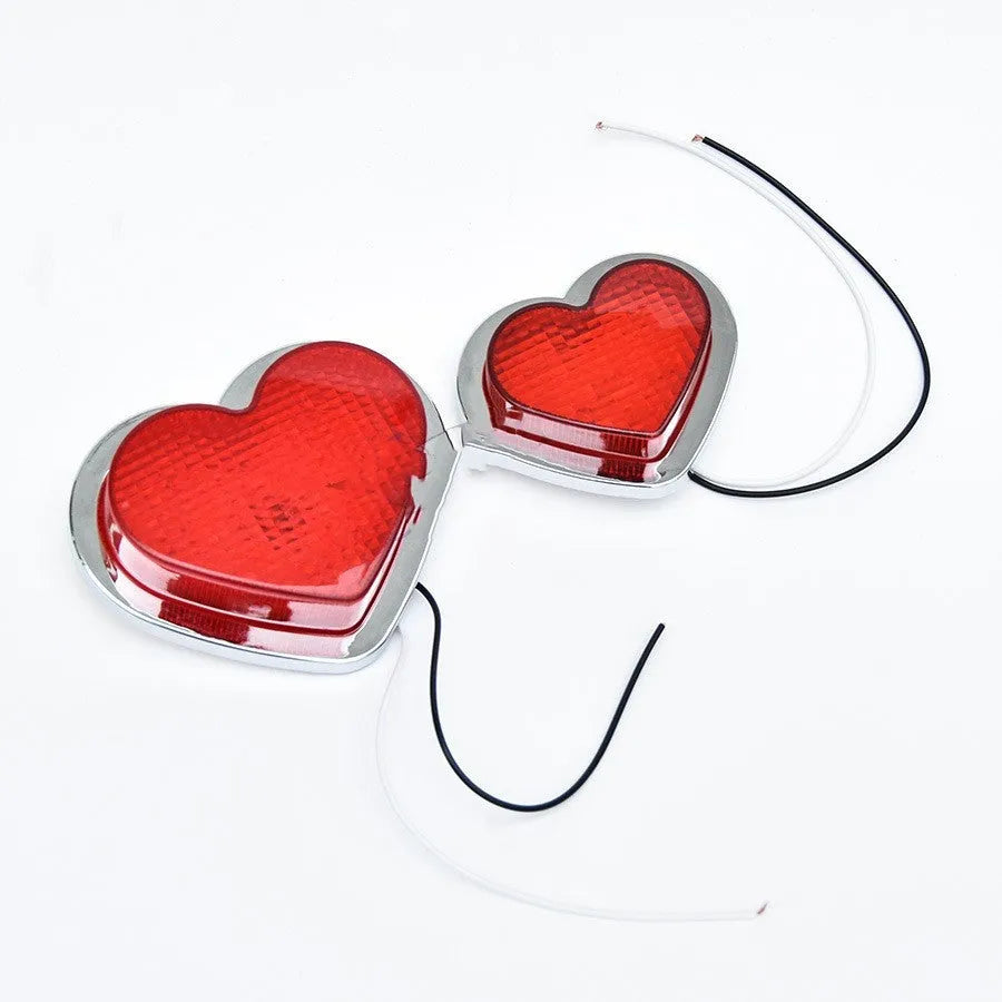 12V heart-shaped red LED automotive sidelight for fender mounting on a car.