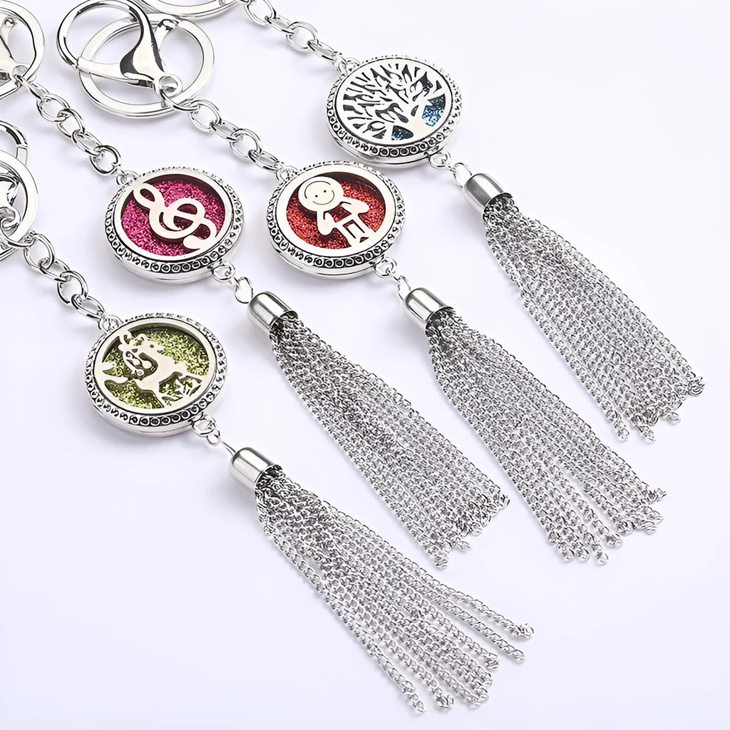 Alloy tassel-style car fragrance pendant with cotton pads hanging from rear-view mirror